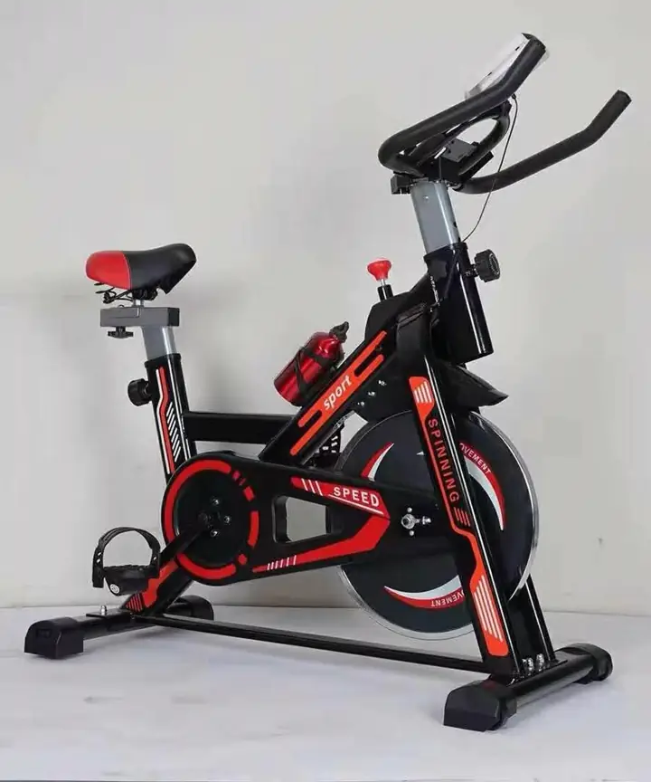 The Sage Fitness spinning bike standing in a room