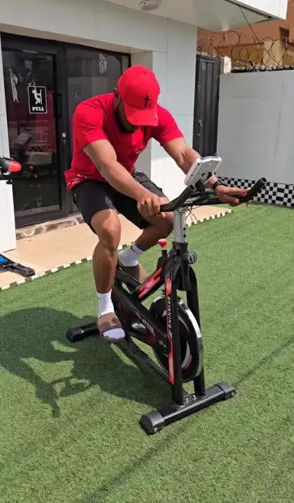 Customer riding the spinning bike outdoors