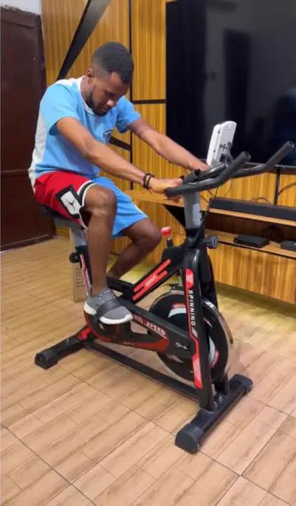 Customer riding the spinning bike at home