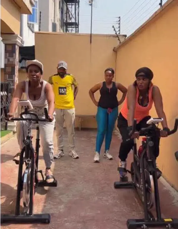 Group of customers riding their spinning bikes together